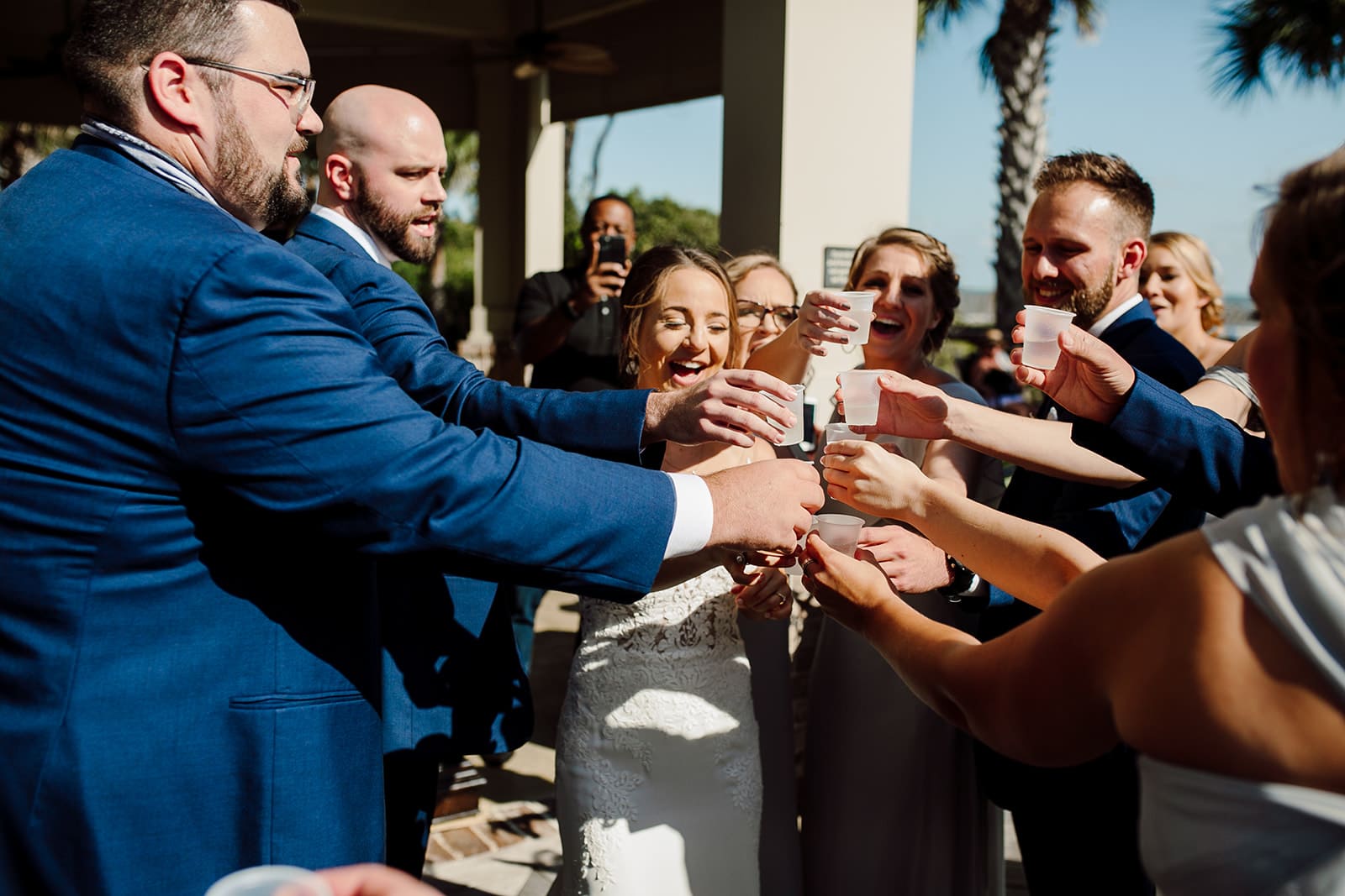 Clara and Tyler and their friends celebrate their Destination Wedding with a toast