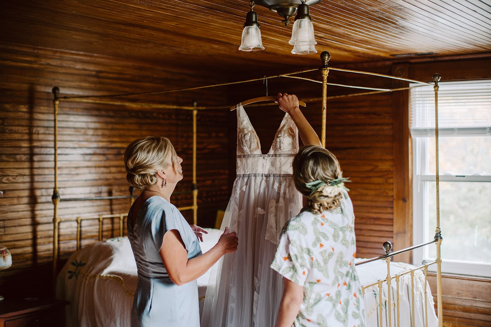 A bride and her mother admire her wedding dress prior to her Asheville Wedding celebration