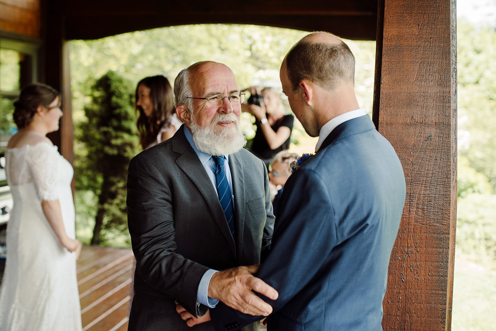 Jim and his father share a moment during Jim and Rachel's Asheville Wedding Day photographed by Wilder Weddings Collective