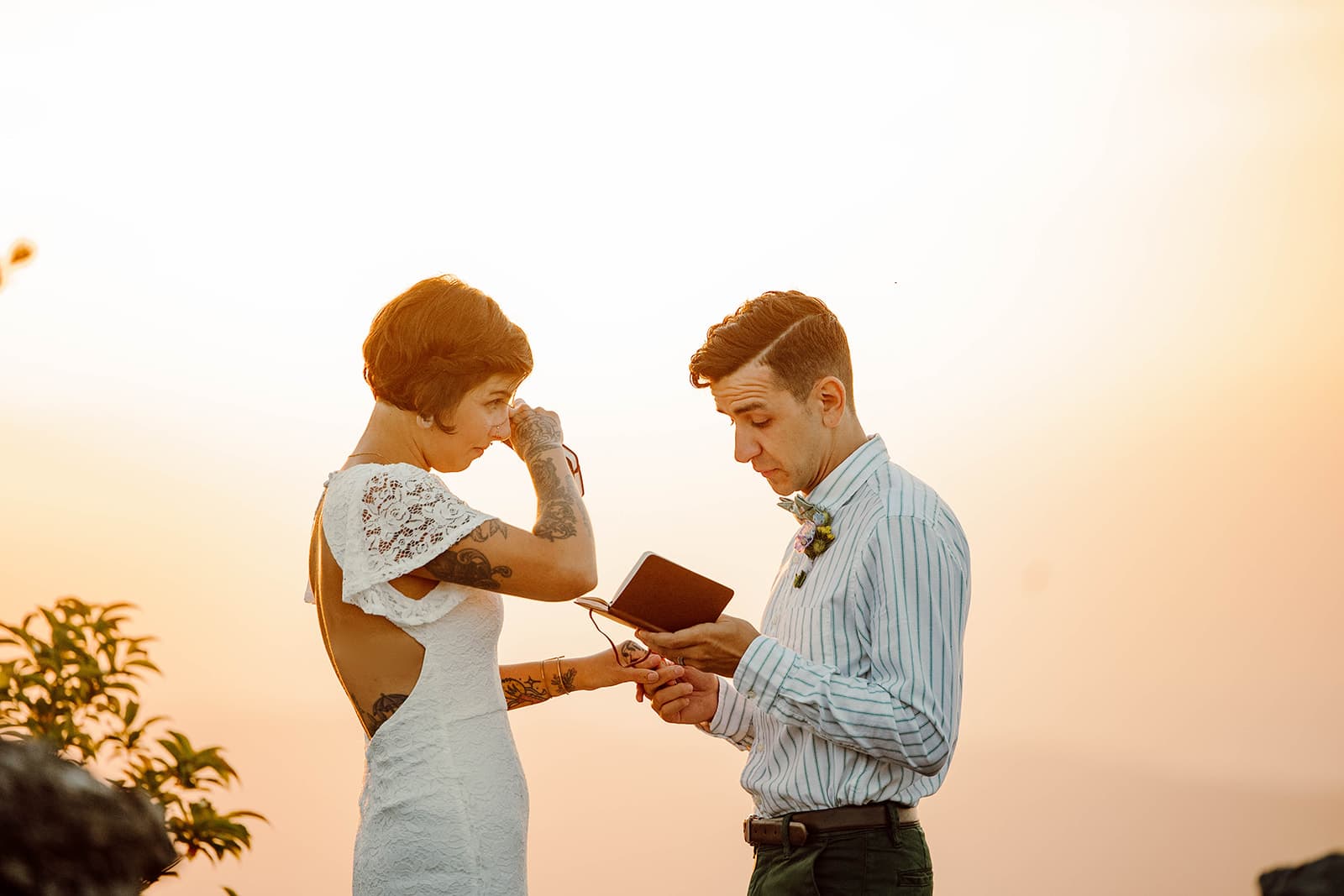 maya and brandon exchange vows at sunrise during their Asheville Adventure Elopement