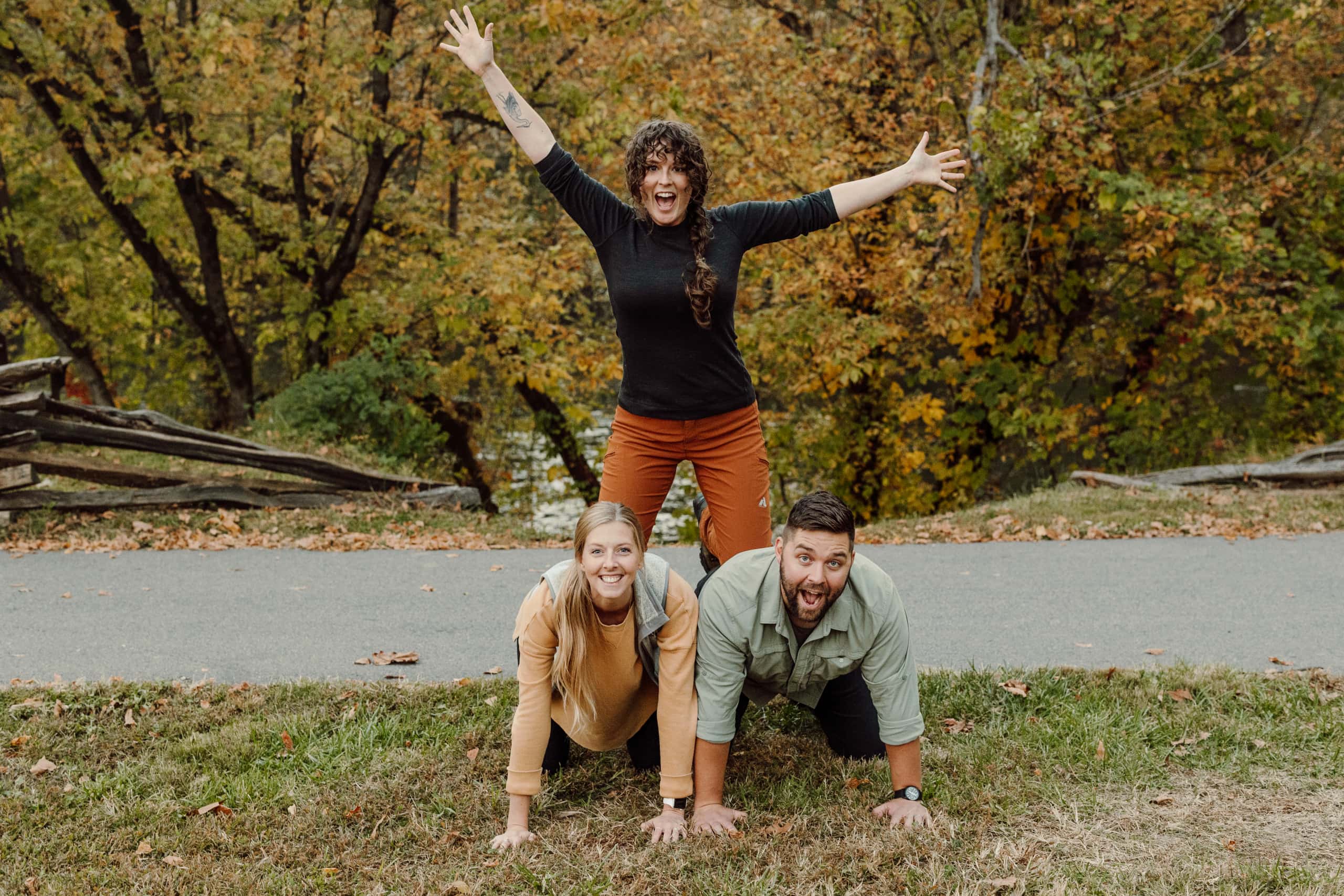 A human pyramid including Carolyn, Caroline and Jake from Asheville-based Wedding Photography Collective, Wilder Weddings Collective