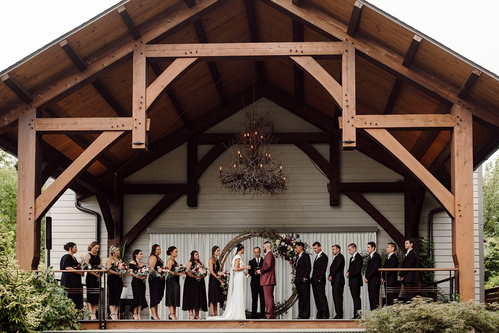 casey+eric stand with their bridal party during their Asheville wedding at Haiku