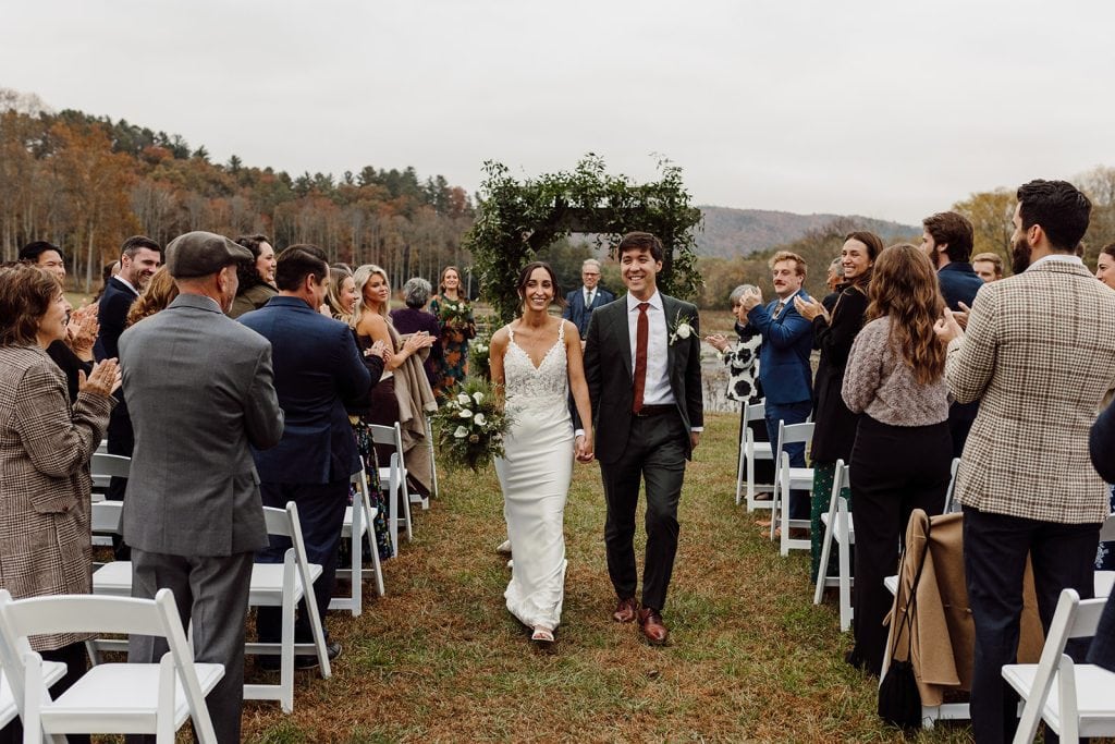 Maraia+Kyle walk back down the aisle after their Brevard Wedding