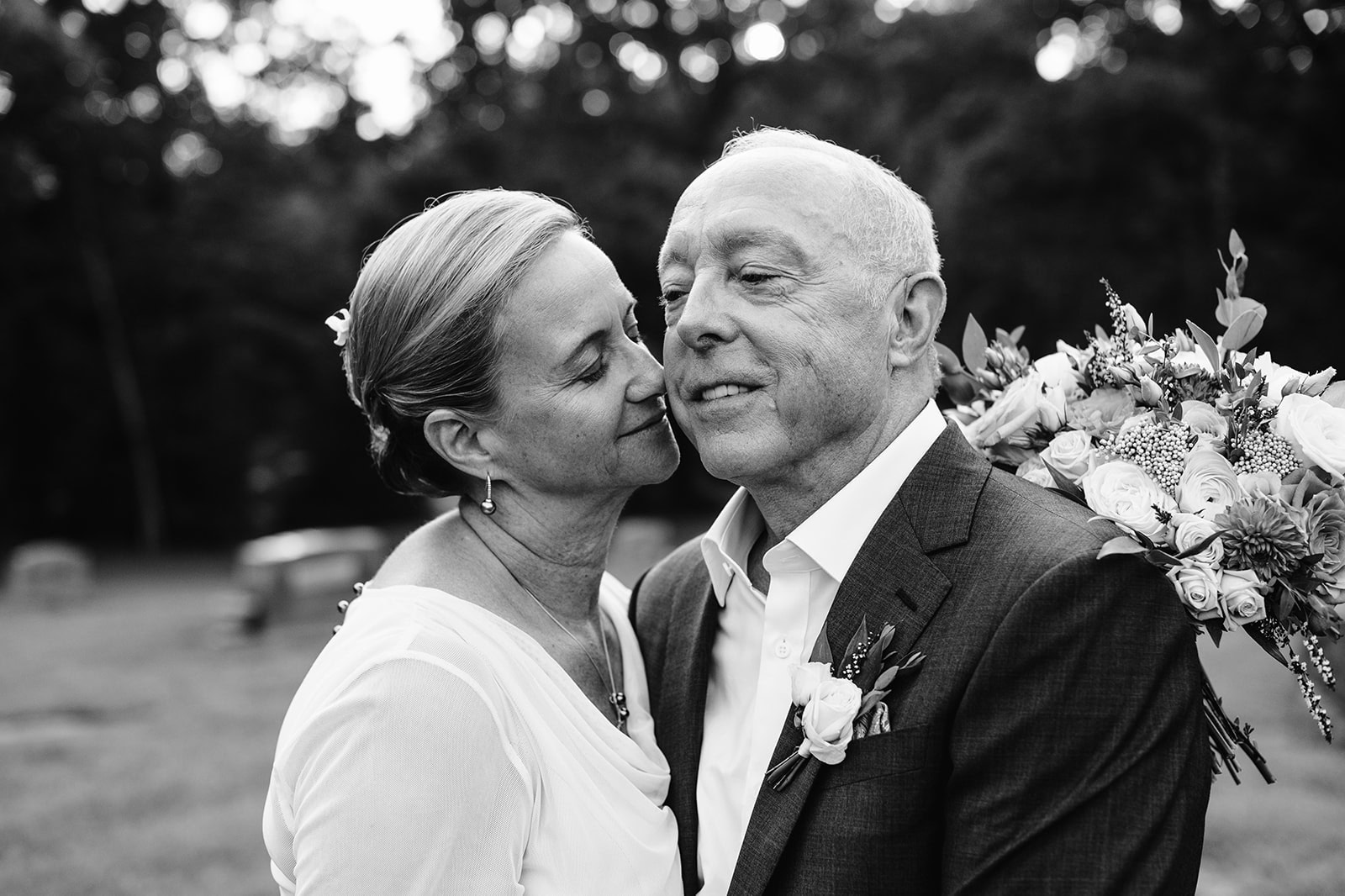 Mary and Tom embrace for a portrait on their wedding day in Huntersville, NC