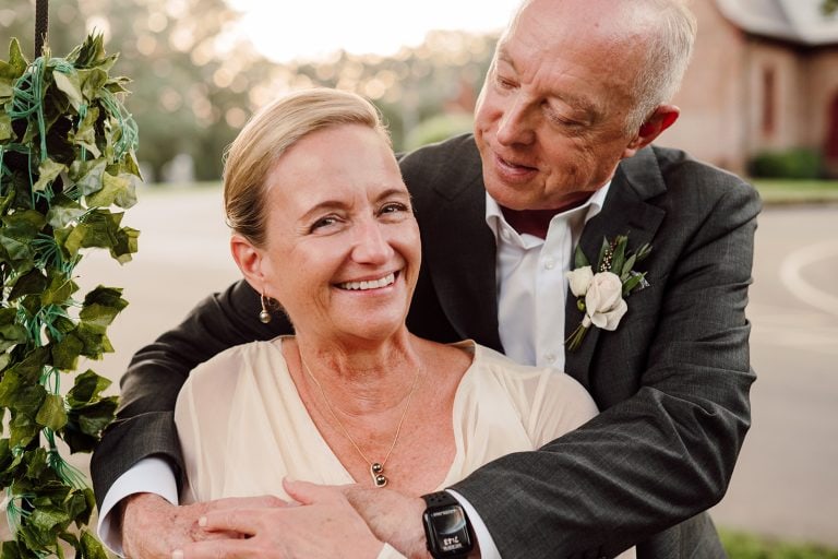 Mary and Tom embrace for a golden hour portrait on their wedding day in Huntersville, NC