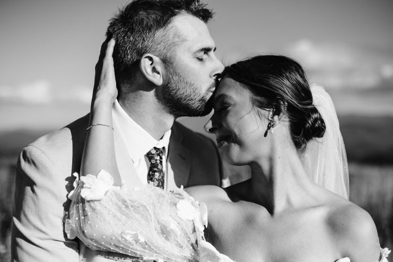 Morgan and Brent embrace during their Mars Hill, NC mountaintop wedding