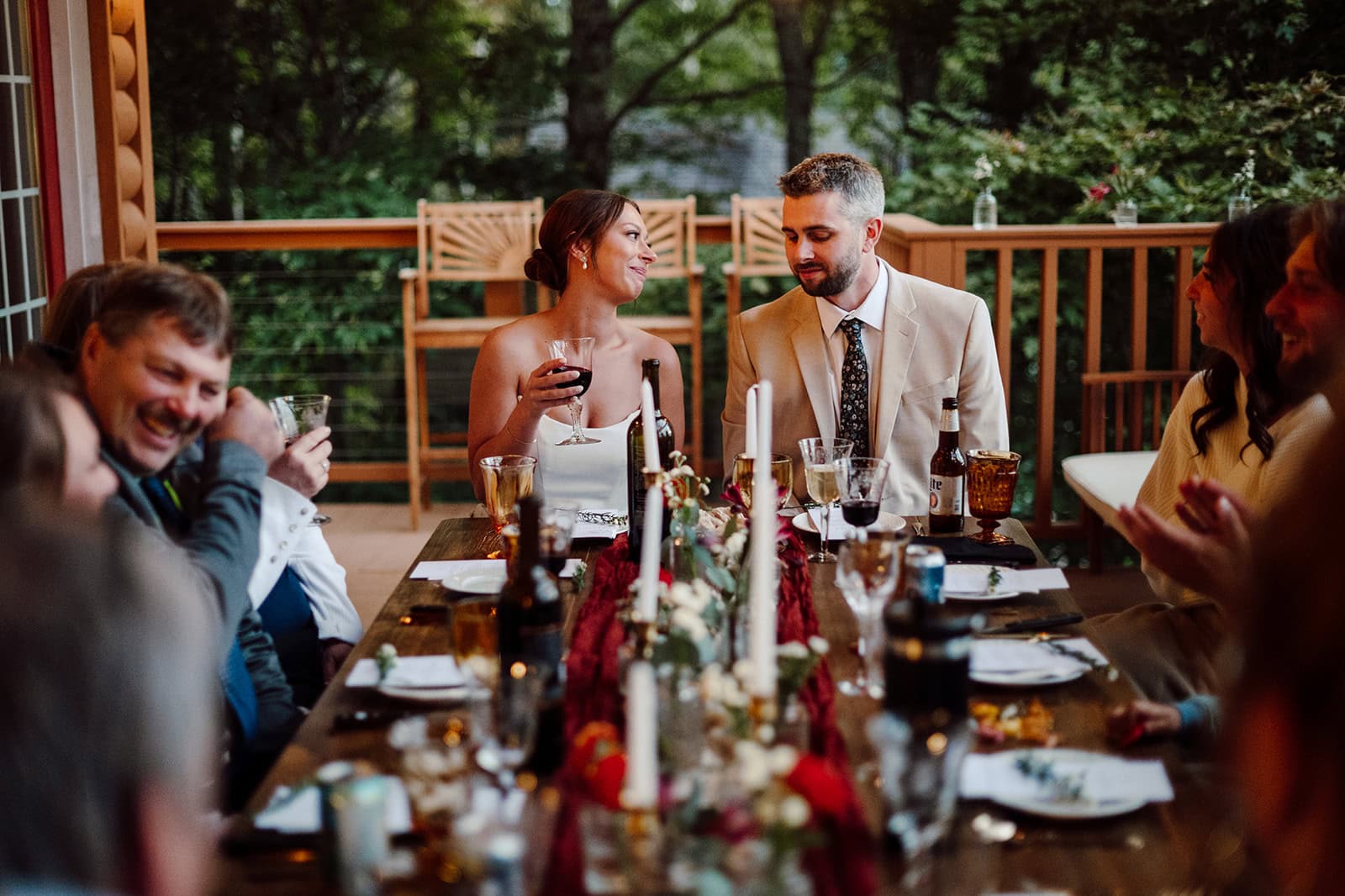 Morgan and Brent enjoy dinner with their friends and family during their Mars Hill, NC wedding