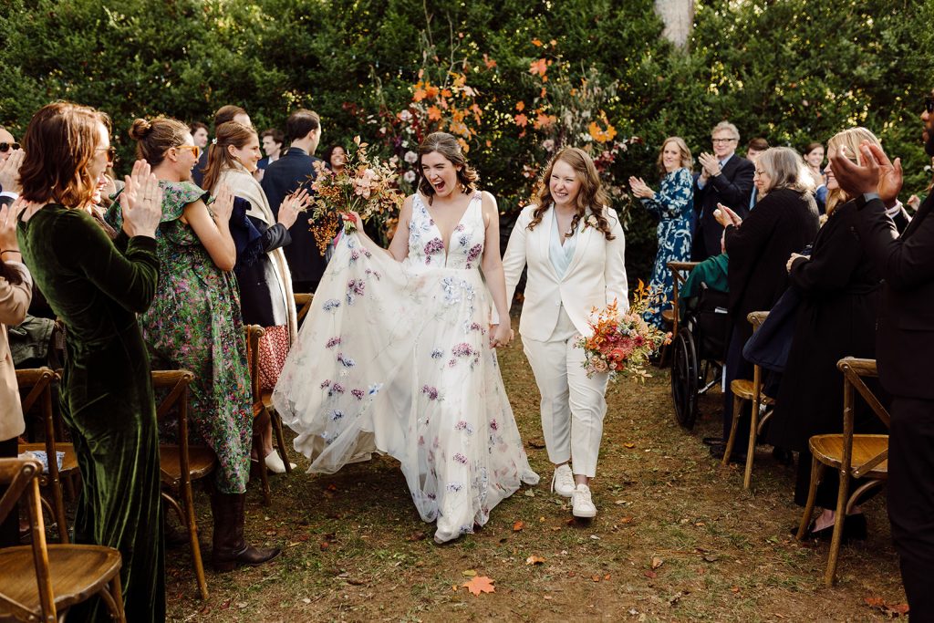 margot+sarah anne walk back down the aisle after their ceremony at Sherill's Inn in Fairview, NC
