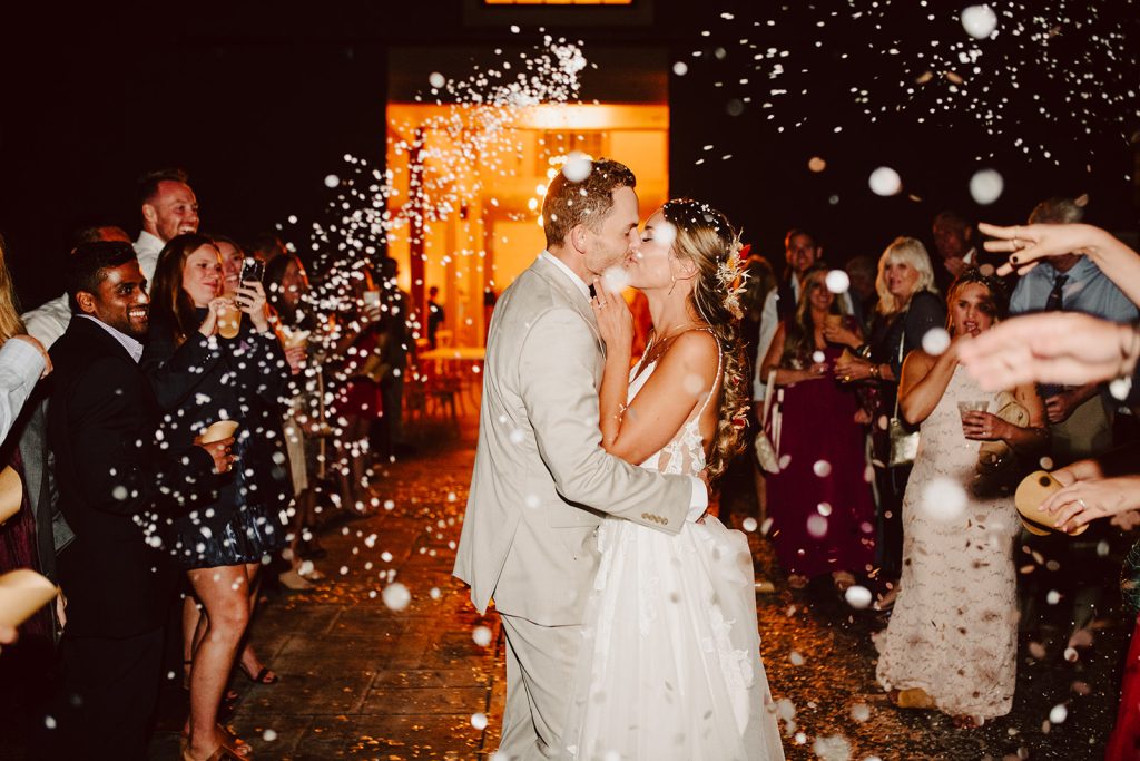 kara+kyle exit their wedding surrounded by friends and family in Mills River, NC